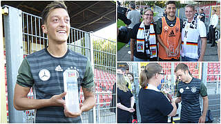 Strahlende Gesichter: Özil, Hector und Götze erhalten Auszeichnungen von Fans © DFB