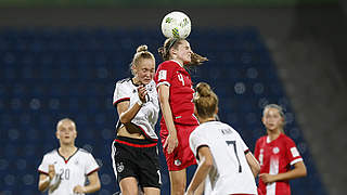 Germany's Janina Minge shares an areal duel with Marika Guay.  © 2016 FIFA