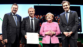 Klinsmann was honoured by Chancellor Angela Merkel and DFB president Reinhard Grindel © 2016 Getty Images