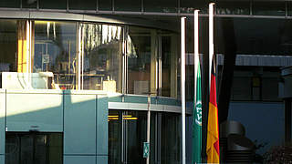 Flags at the DFB headquarters in Frankfurt are flying at half-mast to remember the victims © DFB