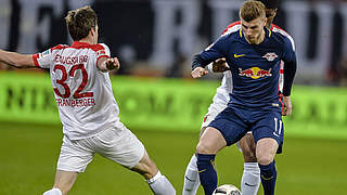 U21 Germany International Timo Werner is surrounded by two Augsburg players. © AFP/Getty Images