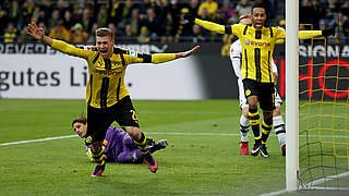 Lukasz Piszczek (left) celebrates one of his five Bundesliga goals: 