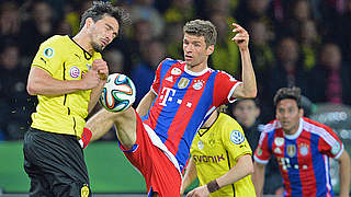 Weltmeister unter sich: Mats Hummels (l.) im Zweikampf mit Thomas Müller © 2014 Getty Images