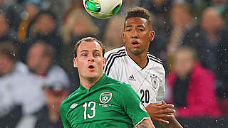 Jerome Boateng battles Ireland's Anthony Stokes for the ball in last year's meeting © 2013 Getty Images