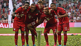 Thomas Müller and his Bayern teammates celebrate success in the Audi Cup © 2015 Getty Images