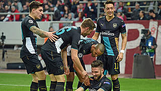 Mesut Özil & Co. celebrate their progression to the round of 16  © 2015 Getty Images