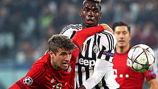 Paul Pogba and Thomas Müller battle for possession © 2016 Getty Images