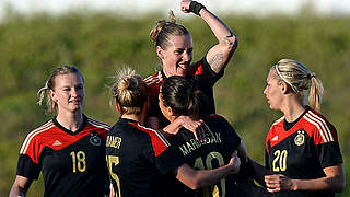 Celebrates with teammates: Germany's midfielder Simone Laudehr (Top) © AFP